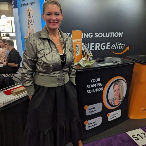 Melissa Brown standing in front of the concierge elite booth.